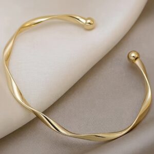 A Minimalist Adjustable Open Bangle for Women with a Twisted Design.