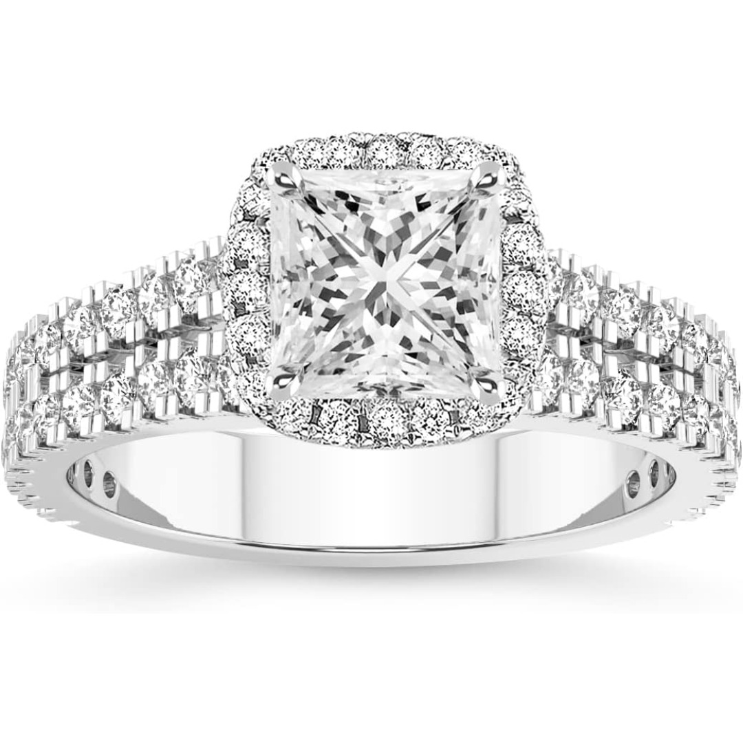The VVS Lab-Grown Diamond Solitaire is a high-specification jewelry piece that prioritizes clarity, scale, and ethical luxury. VVS Clarity Lab Diamond: Features a "Very, Very Slightly Included" gemstone, ensuring a crystal-clear appearance that is virtually indistinguishable from the finest natural diamonds. Versatile Carat Range: Offered in 1, 2, 3, 4, and 5-carat options, providing a bespoke fit for every style, from minimalist elegance to breathtaking "statement" luxury. Premium S925 Foundation: Forged from high-grade Sterling Silver and finished with an advanced electroplating layer to provide a hypoallergenic, high-luster glow. Classic Four-Prong Mount: The minimalist setting is designed to "lift" the diamond, allowing maximum light entry to emphasize the stone's natural refraction. Multi-Occasion Appeal: A timeless silhouette that serves as the perfect Engagement Ring, Wedding Band, or Valentine’s Day surprise.