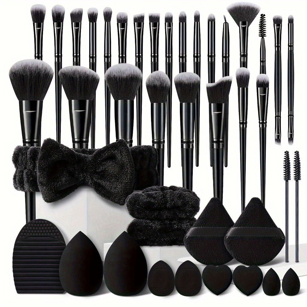 A Set of Black Makeup Brushes Featuring 13 Premium Synthetic Tools for Foundation, Concealer, Eyeshadow, And Blush, Along with a Makeup Sponge And a Cleaning Tool.