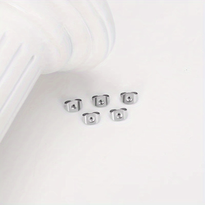 1 Box of Approximately 200 Textured Butterfly-Shaped Silvery Earplugs - Image 2